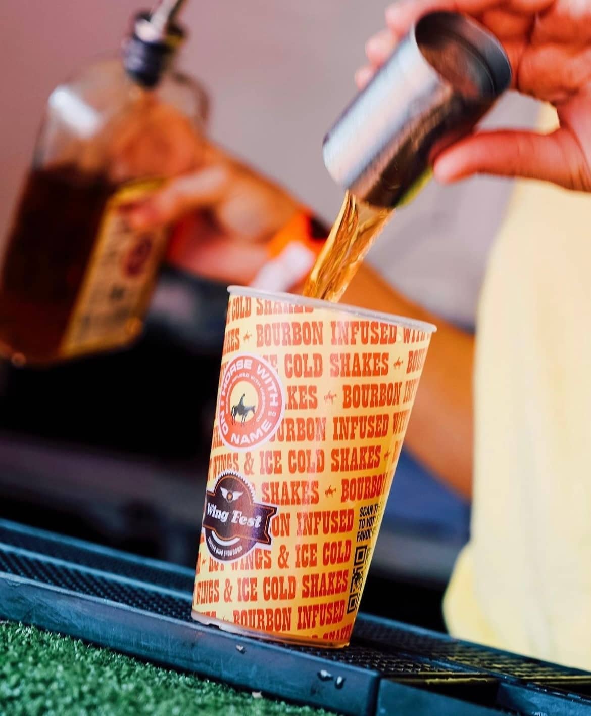 Reusable pint cups stacked at a UK festival bar