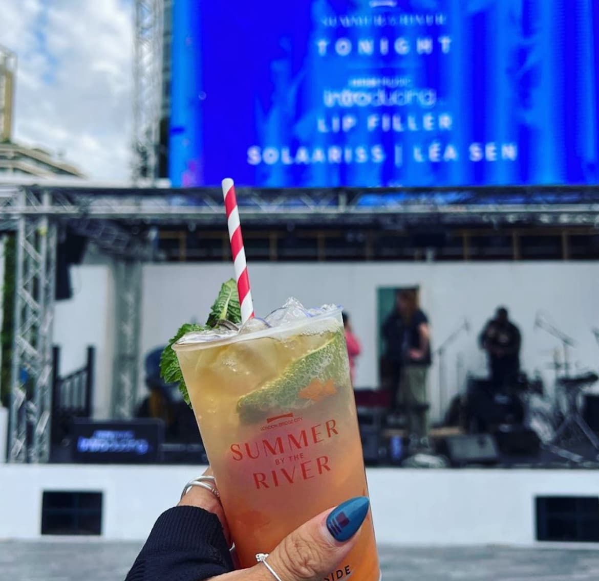 Reusable festival cups being used at a green outdoor event