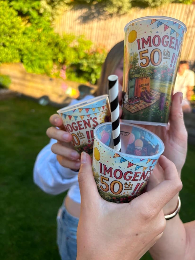 Three personalised full colour cups printed for a 50th birthday garden party